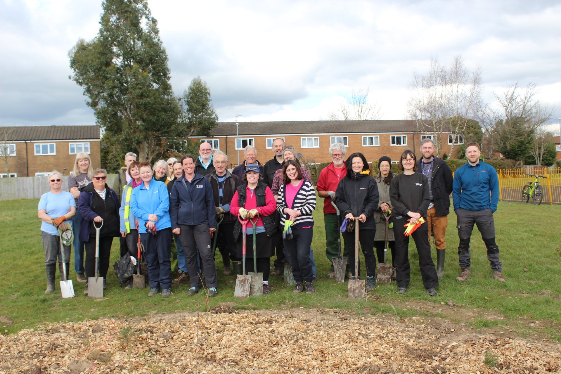 Group of people with spades after digging