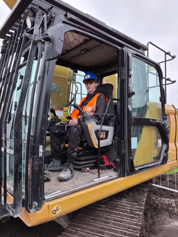 PVC learner pictured at the controls of a digger