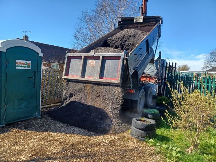 Picture of truck unloading the gravel