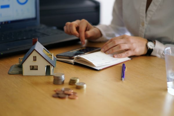 closeup-shot-person-thinking-buying-selling-house