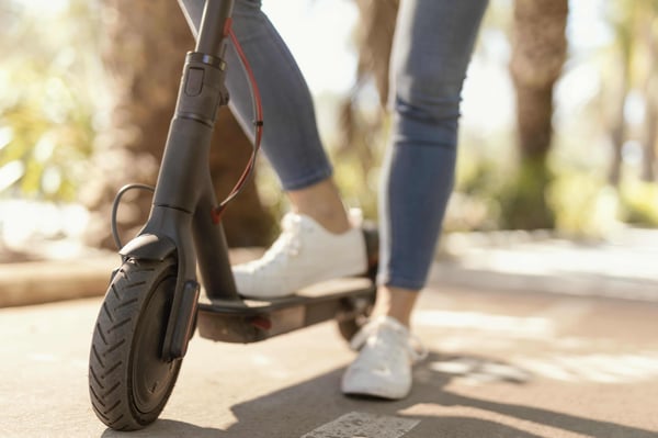 young-woman-rides-electrical-scooter-city